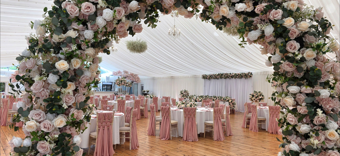 dusky pink rose arch in a country garden style