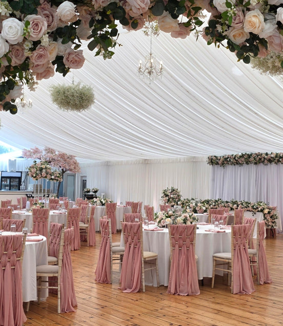 dusky pink rose arch in a country garden style